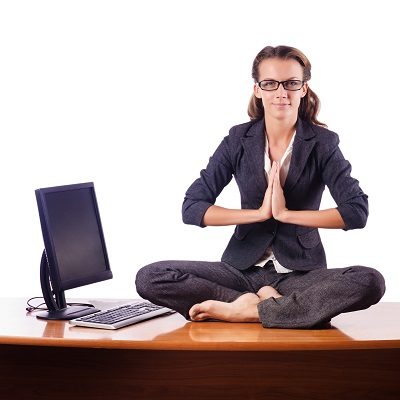 Woman meditating on the desk